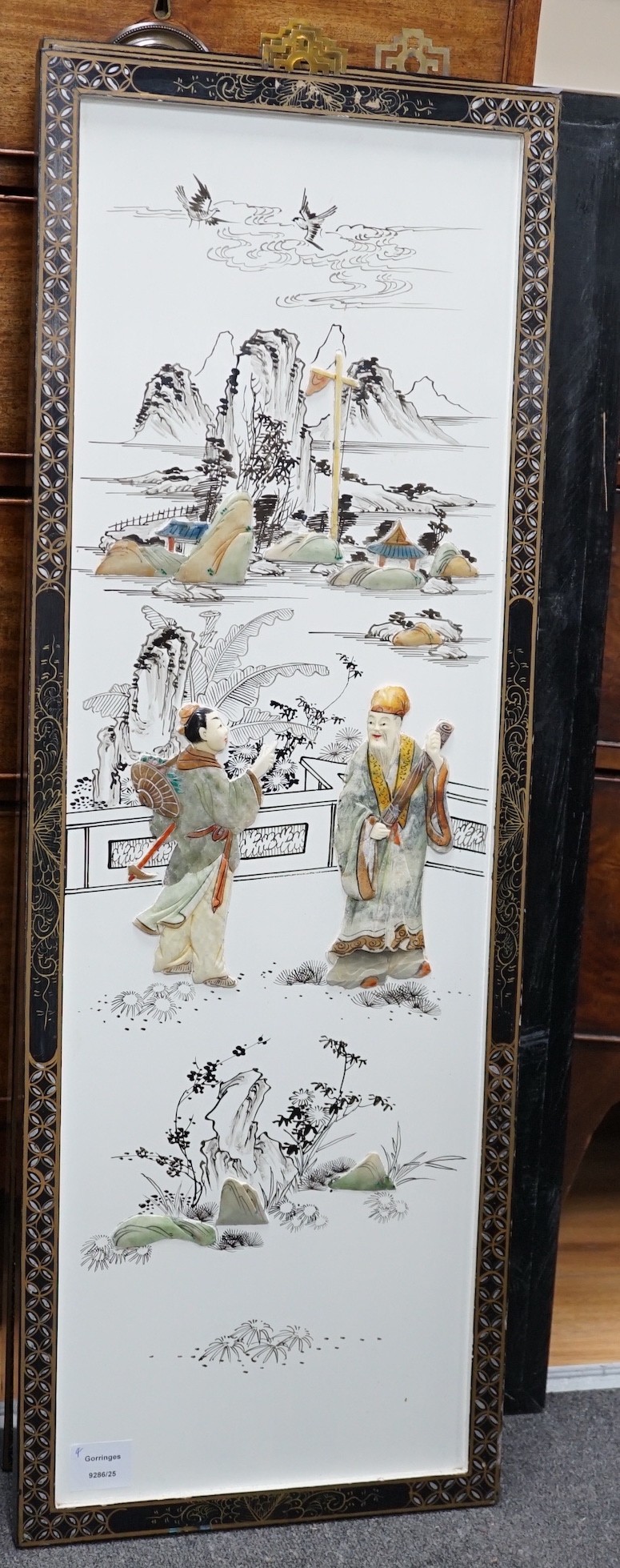 A set of four Chinese lacquer and soapstone mounted panels, 95 x 33cm